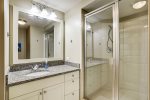 Third bathroom has glass walk-in shower and is located across the hall from third bedroom. 